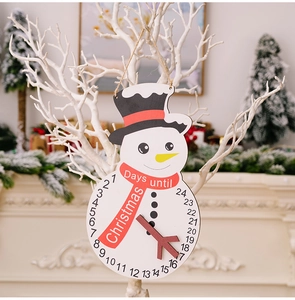 Close-up of wooden snowman Christmas advent calendar with 24-day countdown dial and pointer
