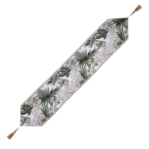Tropical green botanical leaf print table runner with elegant tassels on white fabric