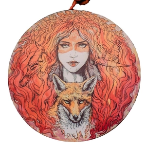 Artistic drum with woman and wolf illustration featuring warm red and gold mystical patterns