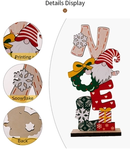 Detail view of wooden Noel Christmas gnome ornament featuring festive printing and snowflake
