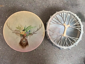 Detailed top view of shaman drum showing reindeer floral print and woven back handle