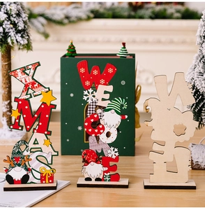 Detail of wooden Xmas gnome table decor with cutout letters and festive holiday patterns