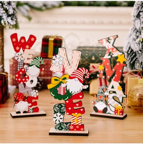Close-up of wooden Christmas gnome signs with Welcome, Noel and Xmas text decorations