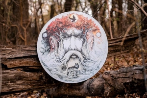 Detail view of Tree of Life shamanic drum featuring mythical crow and wolf patterns