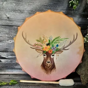Artistic shaman frame drum with hand-painted deer and floral patterns on gradient surface