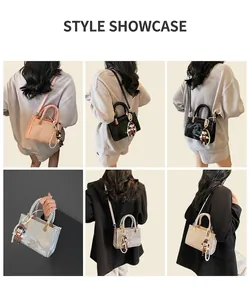 Detail view of stylish square handbags featuring woven handles and cute doll charms