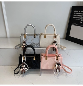 Detailed shot of four stylish crossbody bags with unique braided handles and charms