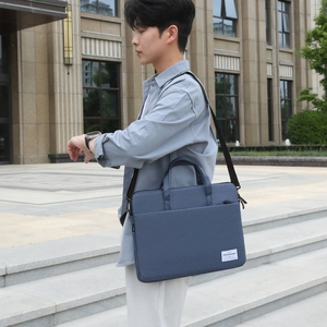 Deep blue water-resistant fabric laptop briefcase with dual handles and shoulder strap