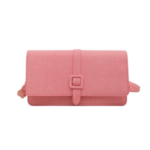 Pink minimalist crossbody flap bag with adjustable strap and buckle on white background