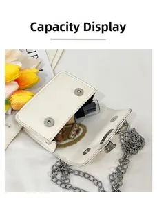 Internal view of a white mini flap bag with metal chain showing storage capacity