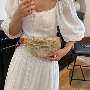 Large woven straw fanny pack for women with brown adjustable strap and gold zipper