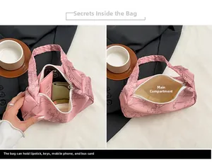 Detail showing inner main pocket of pink fabric bag with bamboo print holding daily items