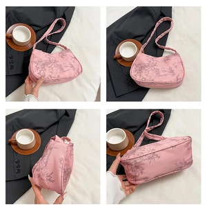 Detailed views of a pink crescent shoulder bag with bamboo print from multiple angles