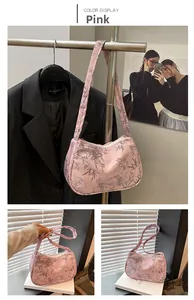 Detail of pink hobo bag with grey bamboo ink print and shoulder strap design