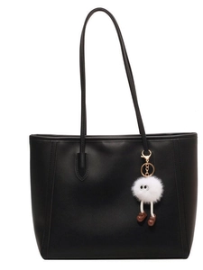 Large black PU leather tote bag for women with a cute white fuzzy monster charm accessory