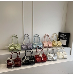 Detailed display of assorted vibrant colors for the glossy faux leather shoulder handbags