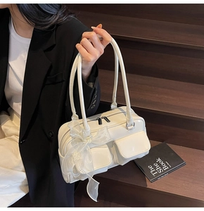 White soft leather Boston bag with dual flap pockets and elegant organza bow detail