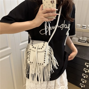 White faux leather tassel crossbody phone bag with rivets in bohemian street style