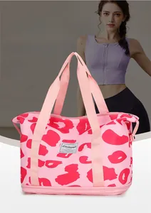 Detailed view of pink leopard print travel bag with wet-dry separation and bottom extension
