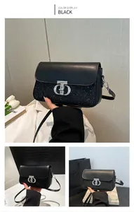 Détail du sac bandoulière noir avec panneau pailleté et fermoir rotatif argenté