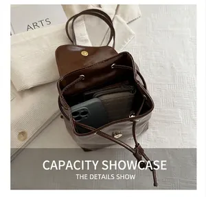 Interior view showing the large capacity of a dark brown drawstring leather backpack