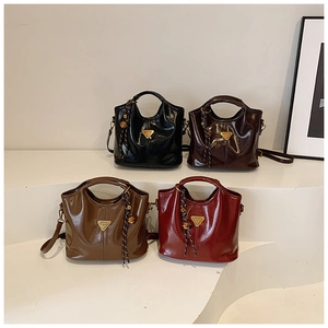 Multi-color oil wax leather bucket bags showing top handles and long shoulder straps