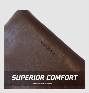 Detail shot of the brown leather texture and embossed logo GAHRES & HEKA on the handbag