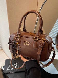 Retro brown Boston handbag in vintage PU leather with tennis racket pendant and shoulder strap