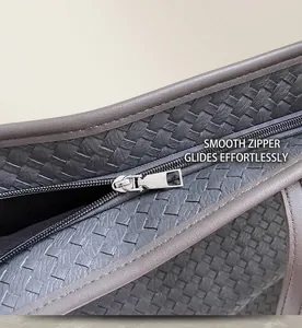 Close-up of a smooth zipper closure on a grey woven texture tote bag for daily use