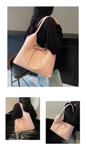 Detailed view of pink tote bag with woven texture and bow ribbon decoration
