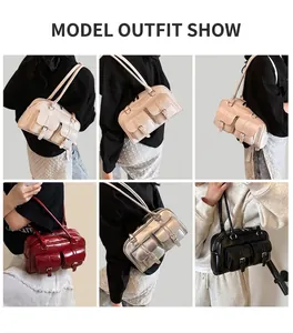 Detail view of large capacity vintage shoulder bag with front buckle pockets and long straps