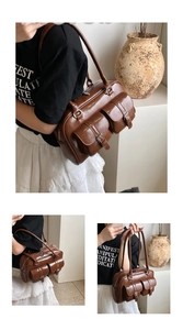 Detail of vintage chocolate brown faux leather shoulder bag with two front flap pockets