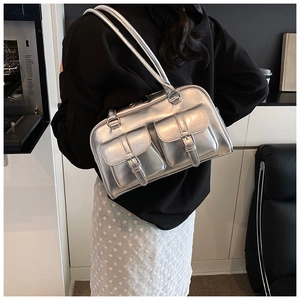 Detailed back view of a metallic silver shoulder bag with two buckle flap pockets