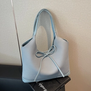 Light blue woven tote bag with bow detail and large capacity for minimalist women commute