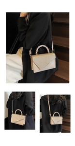 Detailed view of champagne glitter handbag with woven handle and gold metal trim