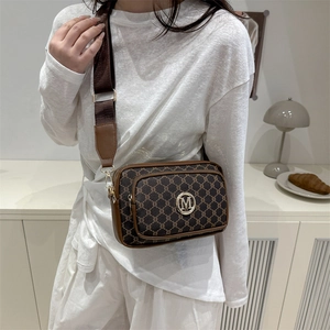 Vintage patterned crossbody bag with wide strap and circular metal M logo for women