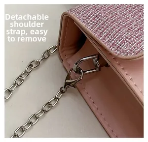 Detail of pink sequin crossbody bag showing the detachable silver metal chain strap