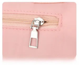 Close-up of durable silver metal zipper on pink Oxford fabric tote bag detailing