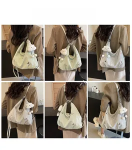 Detailed views of versatile tote bag with silver butterfly and plush cloud charm