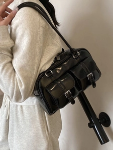 Glossy black high-capacity shoulder bag with twin front pockets and silver buckles