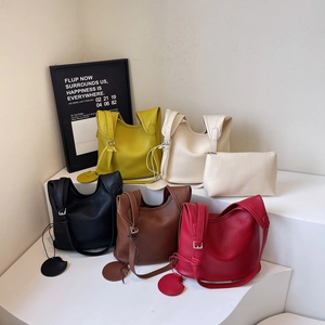 Minimalist litchi grain bucket bag in five colors with adjustable shoulder strap