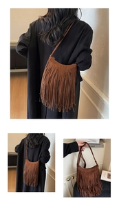 Detailed view of brown faux suede fringe shoulder bag with bohemian tassel accents
