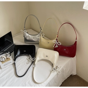Detailed collection of colorful hobo bags with pearl bow charms and branded logo
