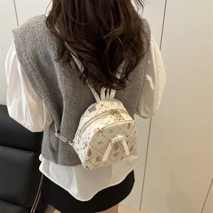 Cute beige mini backpack with cartoon bear and floral print for casual travel