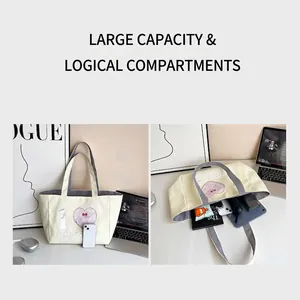 Detailed view of the large capacity interior of this cream canvas tote bag for daily storage