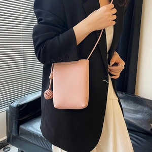 Minimalist light pink lychee texture phone crossbody bag with hand-woven ball pendant