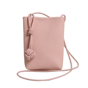 Pink lychee texture leather mini bucket bag with decorative woven knot strap