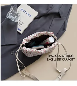Detail view of floral fabric bucket bag showing spacious interior with black lining