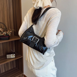 Vintage style black faux leather shoulder bag with silver buckle and Y2K aesthetic
