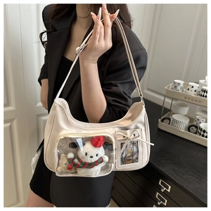 Sac hobo blanc crème avec poche PVC transparente et peluche de chien à l'intérieur
